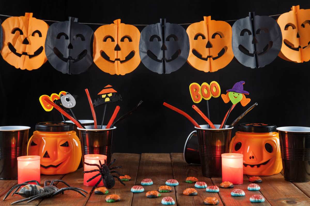 Halloween decorations with pumpkin banners, holders and sweets