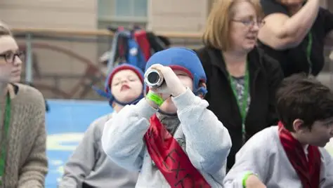 child holding a play handmade telescope
